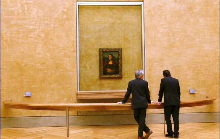 Two men looking at Mona Lisa